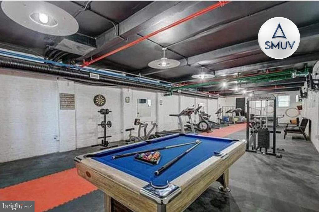 231 East North Avenue, Unit 222 Baltimore, MD 21202 - Photo 5 of 20 Versatile basement retreat with fitness area.
