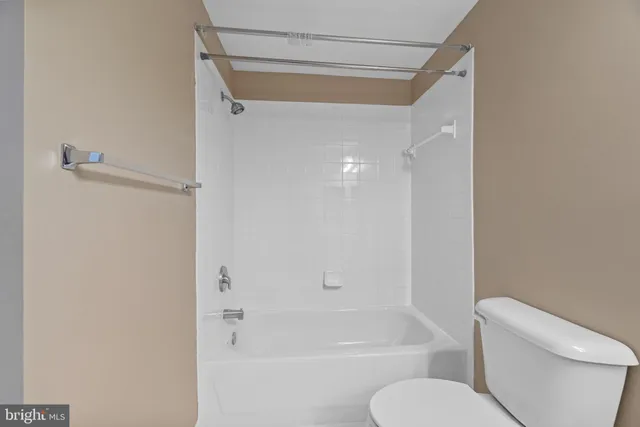 a bathroom with a shower and a toilet
