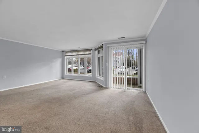 a view of an empty room with a balcony