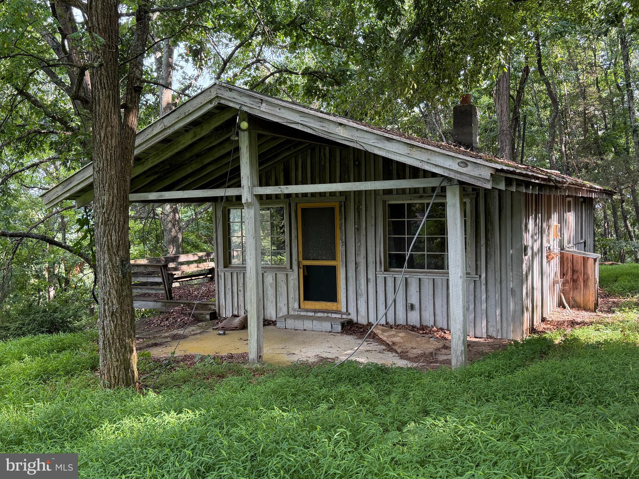584 Berry Mountain Lane Mathias, WV 26812 - Photo 1 of 17 Side view of the cabin/entrance