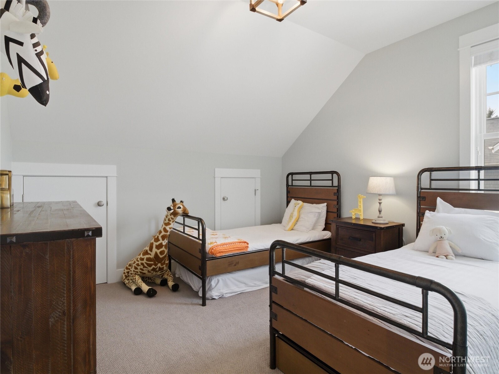 269 Compass Street Pacific Beach, WA 98571 - Photo 22 of 38 a bedroom with two beds and lamp