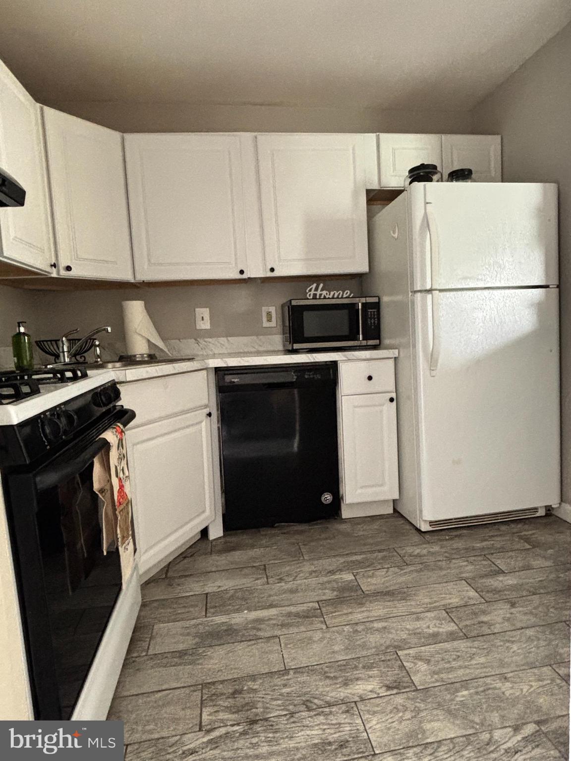 815 Woodchip Road Lumberton, NJ 08048 - Photo 3 of 11 a kitchen with a sink stove and refrigerator