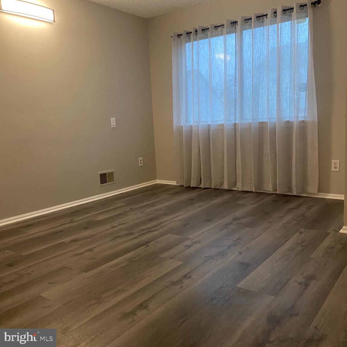 815 Woodchip Road Lumberton, NJ 08048 - Photo 8 of 11 an empty room with wooden floor