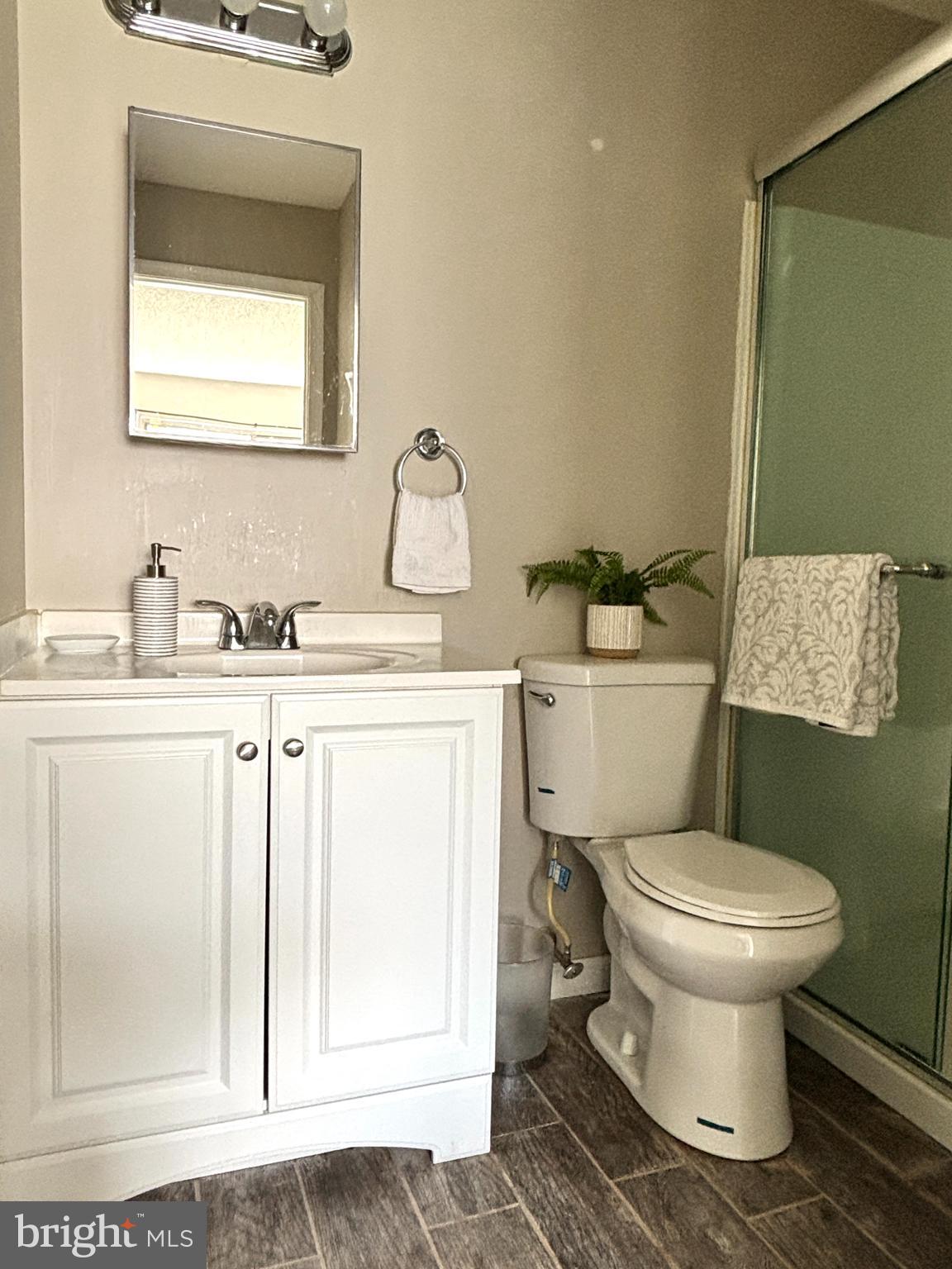 815 Woodchip Road Lumberton, NJ 08048 - Photo 9 of 11 a bathroom with a toilet sink and mirror