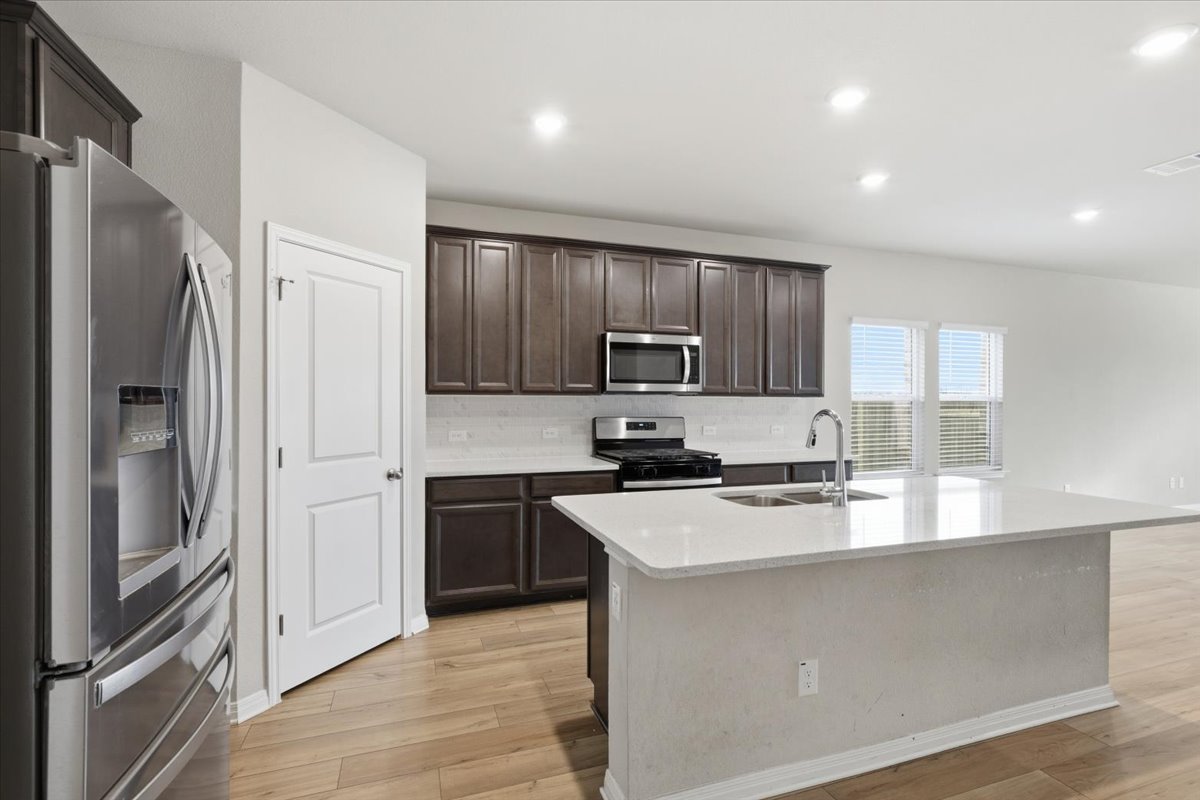17705 Prairie Land Way Manor, TX 78653 - Photo 6 of 29 Stainless steel appliances, kitchen island, walk-in pantry. Plenty of counter space.