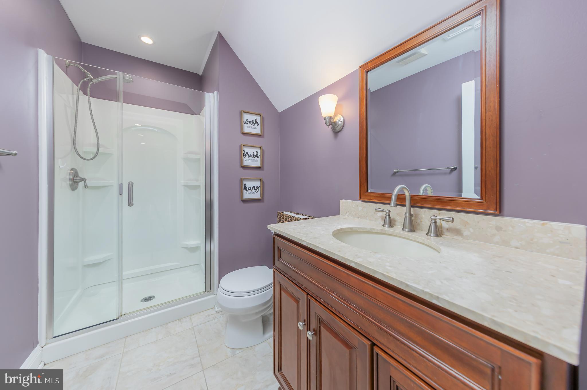 91 Harmony Road Mickleton, NJ 08056 - Photo 22 of 29 a bathroom with a granite countertop sink a toilet and shower