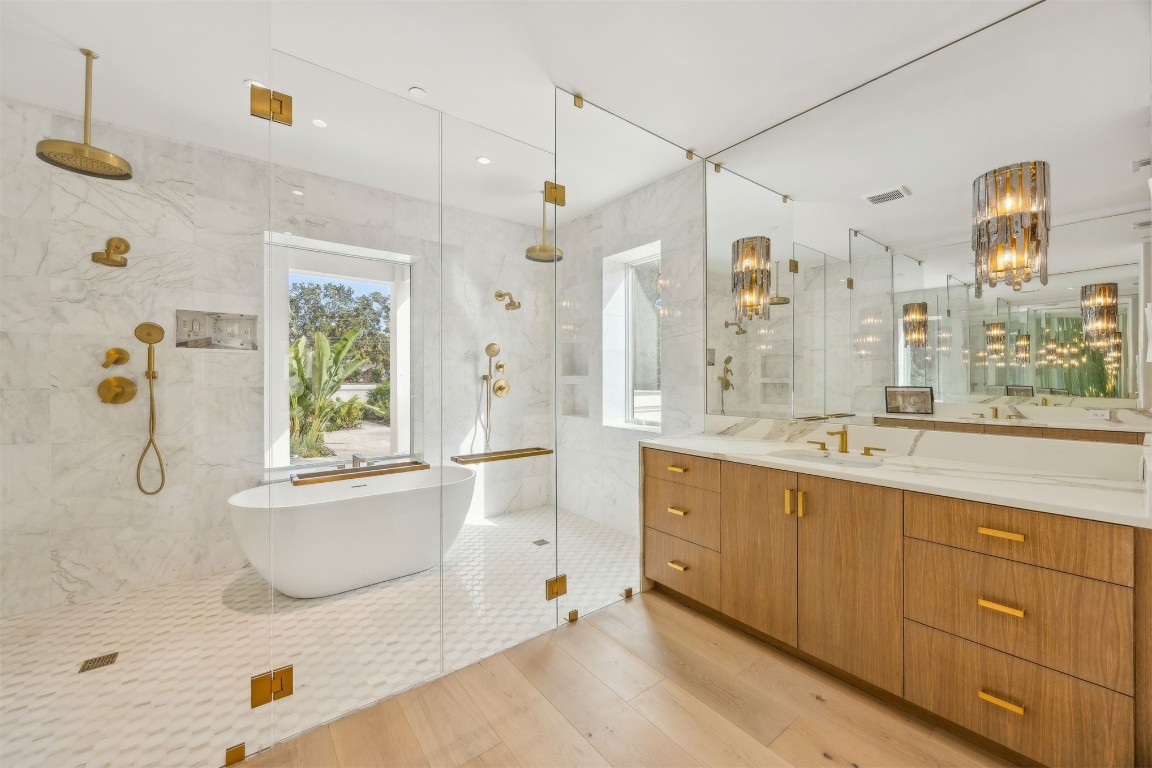 5063 1st Coast Highway, Unit 101D Fernandina Beach, FL 32034 - Photo 23 of 58 a bathroom with a tub sink and mirror