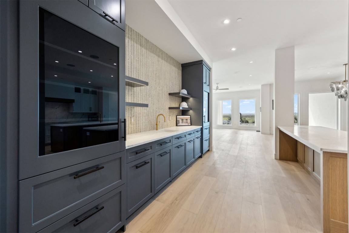 5063 1st Coast Highway, Unit 101D Fernandina Beach, FL 32034 - Photo 3 of 58 a large kitchen with stainless steel appliances kitchen island granite countertop a large counter top and stainless steel appliances