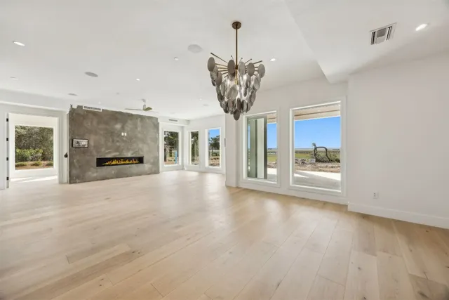 a large kitchen with stainless steel appliances lots of counter top space and cabinets