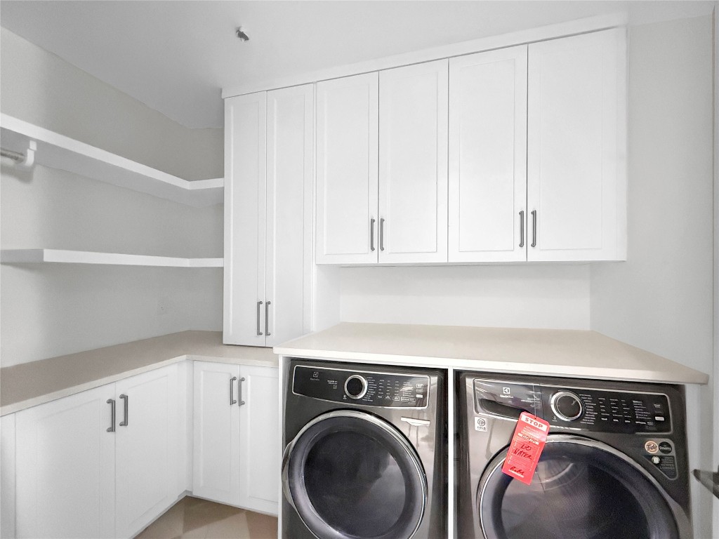 5063 1st Coast Highway, Unit 101D Fernandina Beach, FL 32034 - Photo 39 of 58 a utility room with dryer and washer