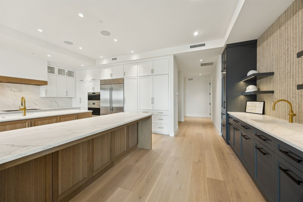 5063 1st Coast Highway, Unit 101D Fernandina Beach, FL 32034 - Photo 5 of 58 a large kitchen with stainless steel appliances lots of counter top space and cabinets