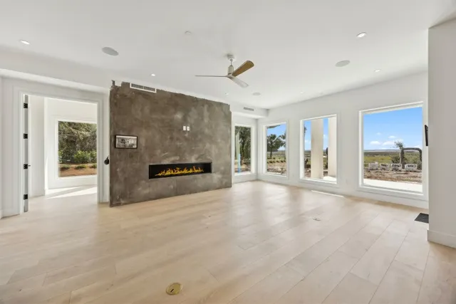 a living room with furniture a fireplace and a potted plant