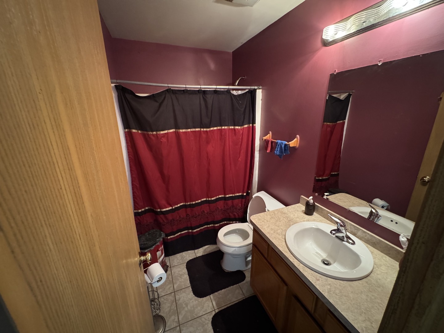 3831 West 154th Street Markham, IL 60428 - Photo 15 of 24 a bathroom with a sink a toilet and mirror