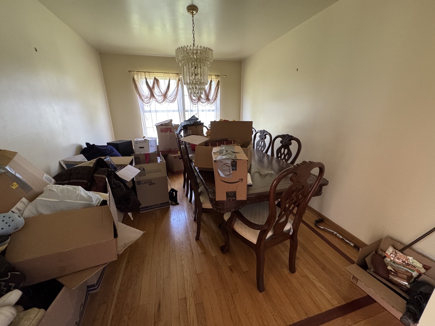 3831 West 154th Street Markham, IL 60428 - Photo 4 of 24 a view of a dining room with furniture window and wooden floor