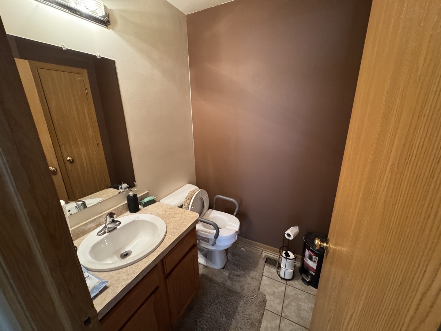 3831 West 154th Street Markham, IL 60428 - Photo 5 of 24 a bathroom with a sink and a mirror