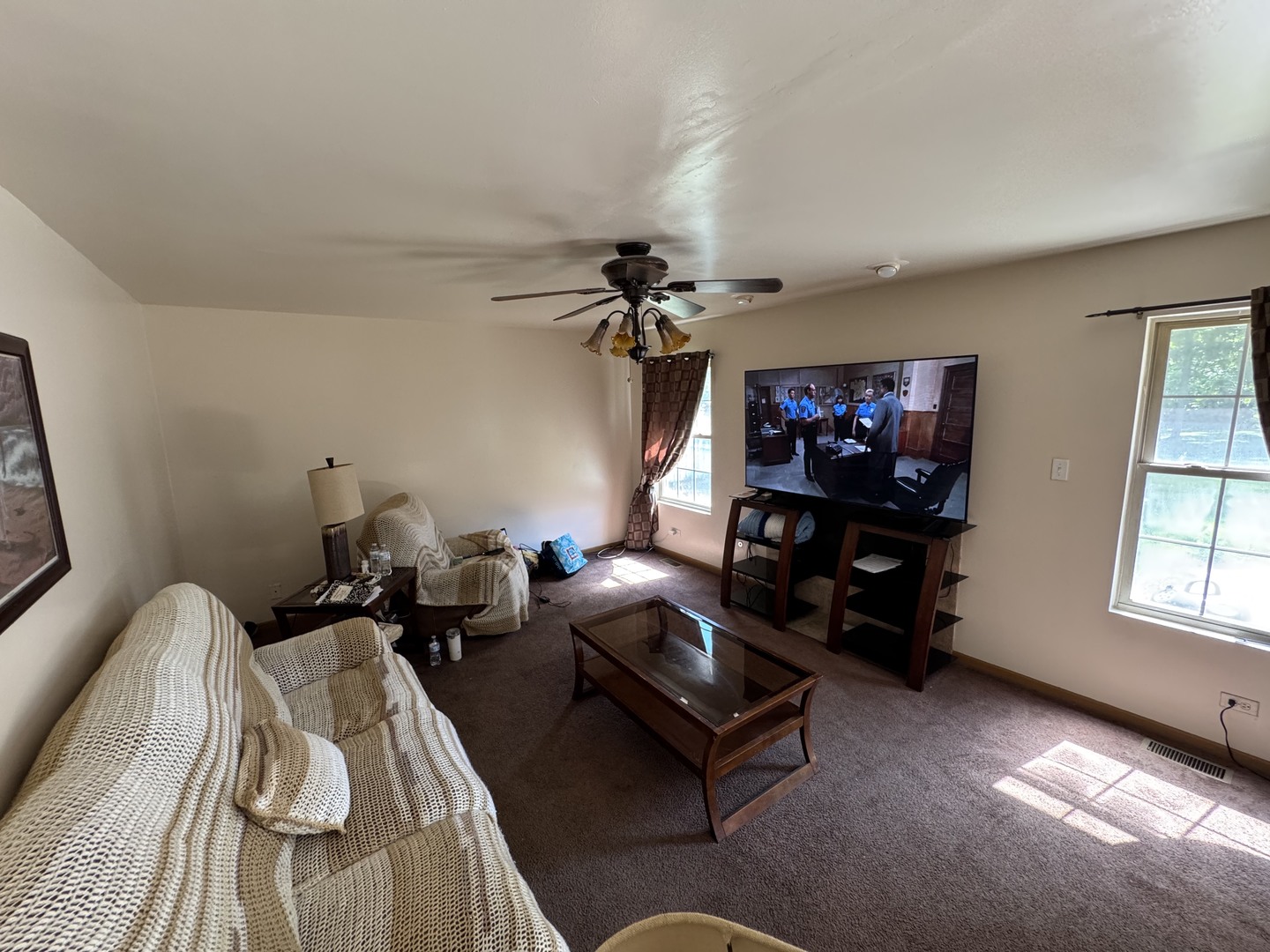 3831 West 154th Street Markham, IL 60428 - Photo 8 of 24 a living room with furniture a chandelier and a window