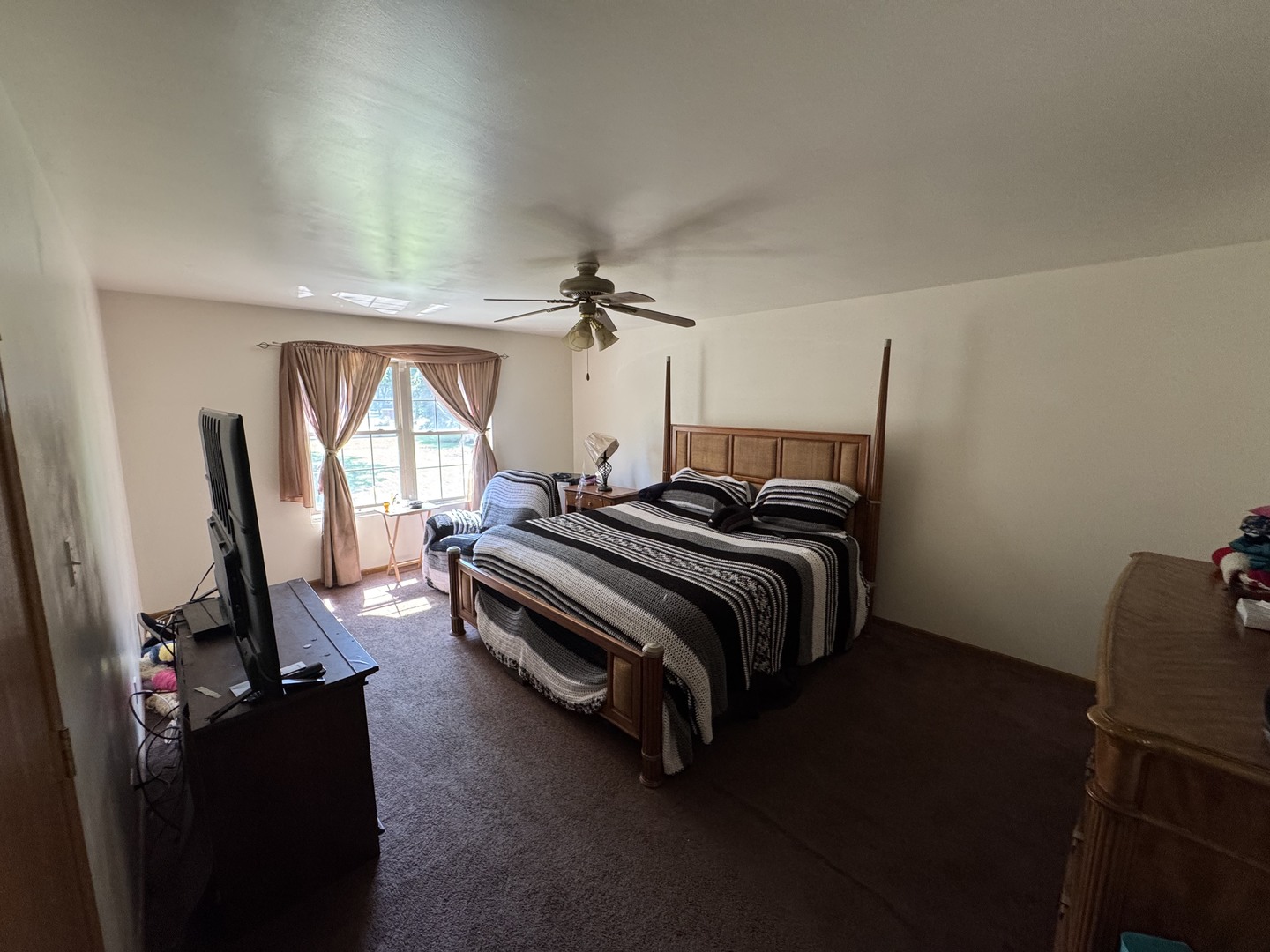 3831 West 154th Street Markham, IL 60428 - Photo 10 of 24 a bed room with a bed and a mirror