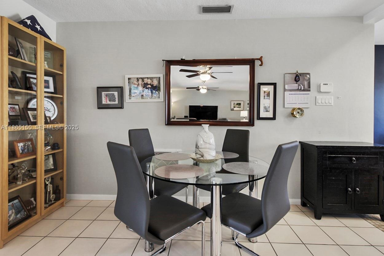 19125 Waterway Road Jupiter, FL 33469 - Photo 11 of 33 a view of a dining room with furniture