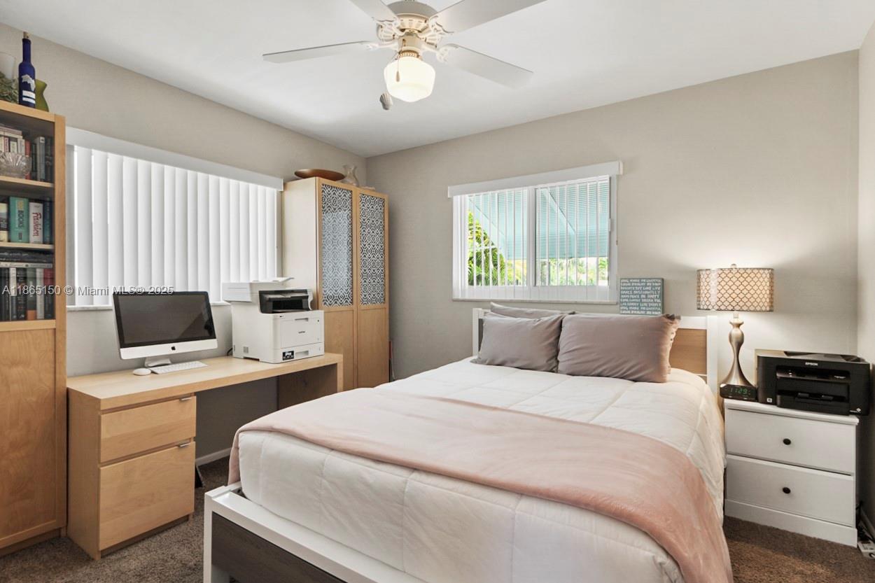 19125 Waterway Road Jupiter, FL 33469 - Photo 15 of 33 a bedroom with a bed and a flat screen tv