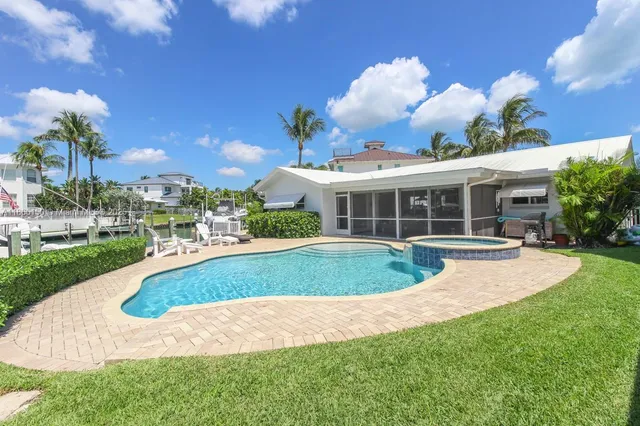 a view of a swimming pool with a patio