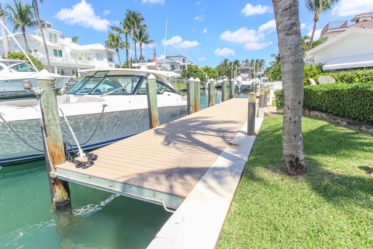 19125 Waterway Road Jupiter, FL 33469 - Photo 24 of 33 a view of a swimming pool with a patio