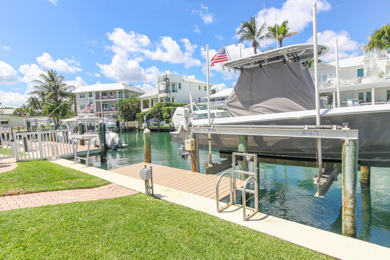 19125 Waterway Road Jupiter, FL 33469 - Photo 25 of 33 a view of a patio with a table and chairs