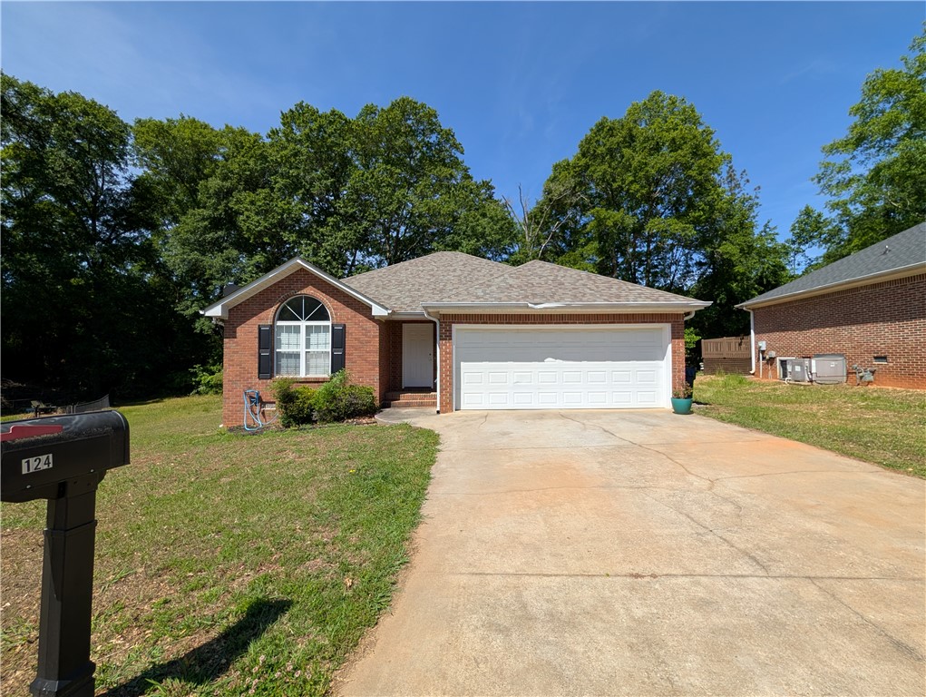 124 Woodbridge Court Anderson, SC 29621 - Photo 1 of 15 This charming brick residence offers a welcoming facade with a convenient attached garage and ample driveway space.