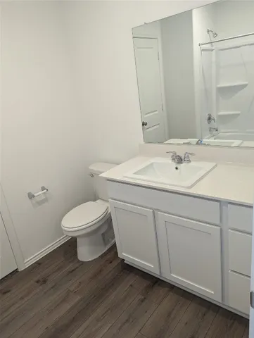 a bathroom with a toilet and a bathtub