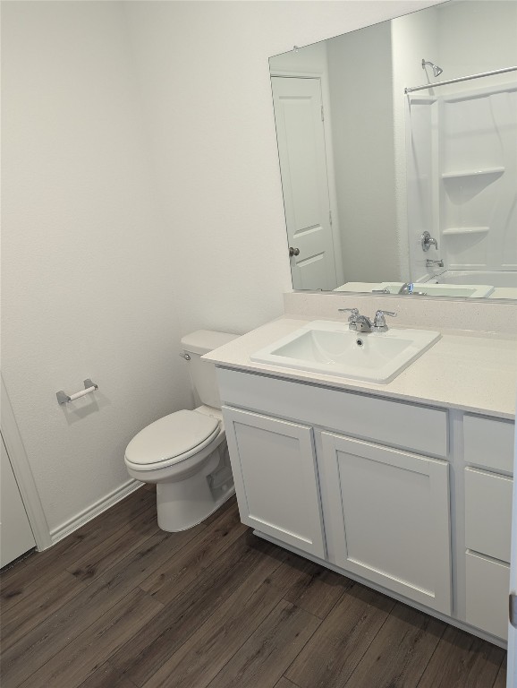 583 Commander Abbott Drive Jarrell, TX 76537 - Photo 13 of 24 a bathroom with a toilet sink and mirror
