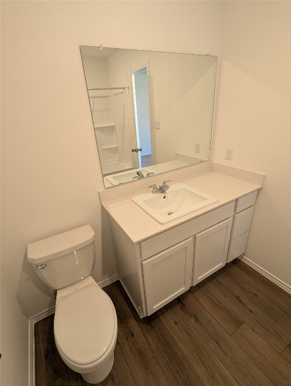 583 Commander Abbott Drive Jarrell, TX 76537 - Photo 15 of 24 a bathroom with a toilet sink and mirror