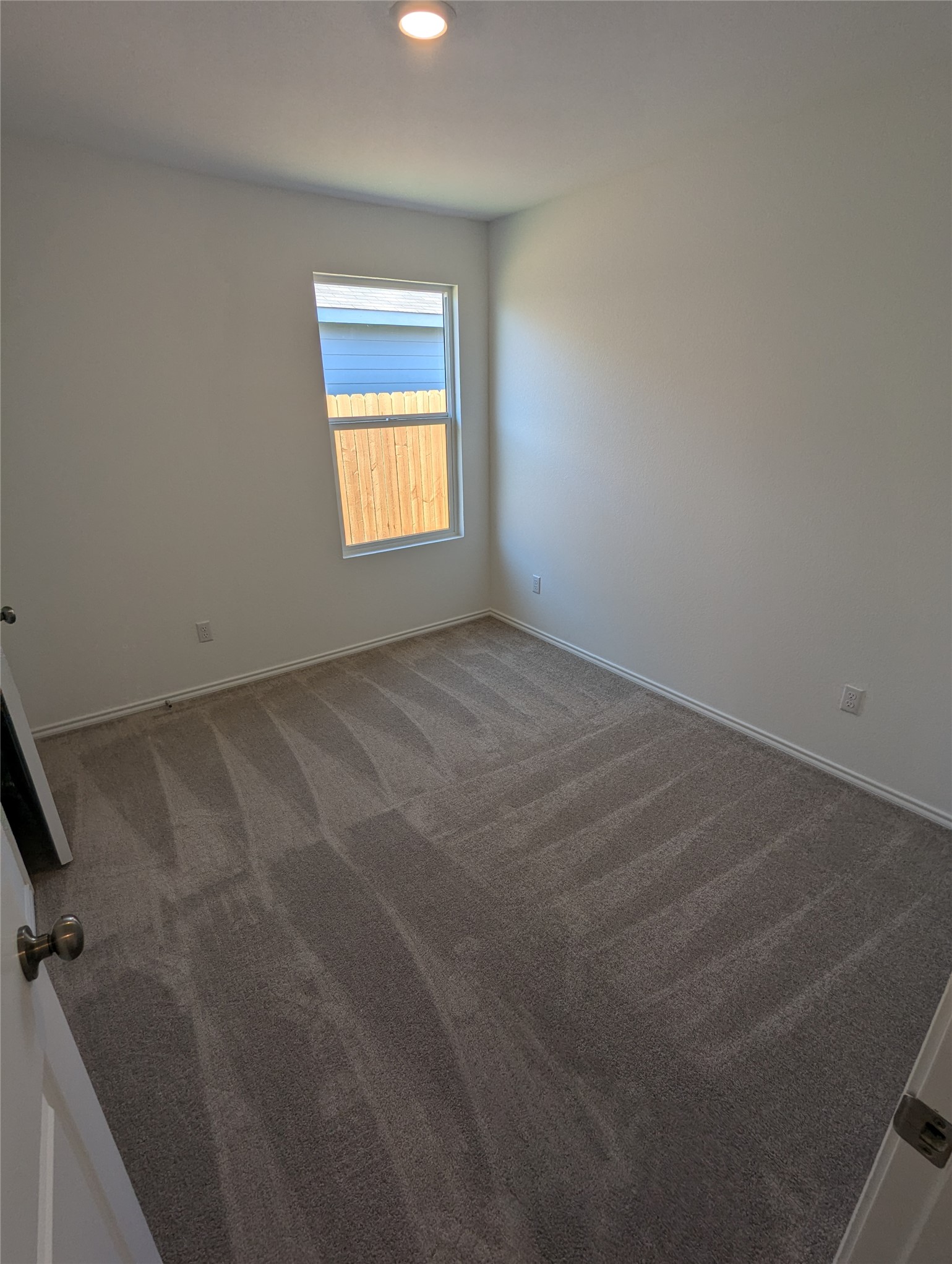 583 Commander Abbott Drive Jarrell, TX 76537 - Photo 17 of 24 a view of an empty room and a window