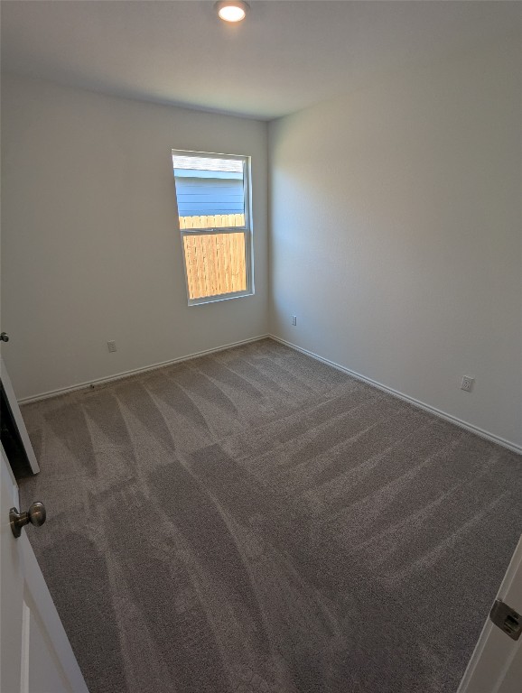 583 Commander Abbott Drive Jarrell, TX 76537 - Photo 17 of 24 a view of an empty room and a window
