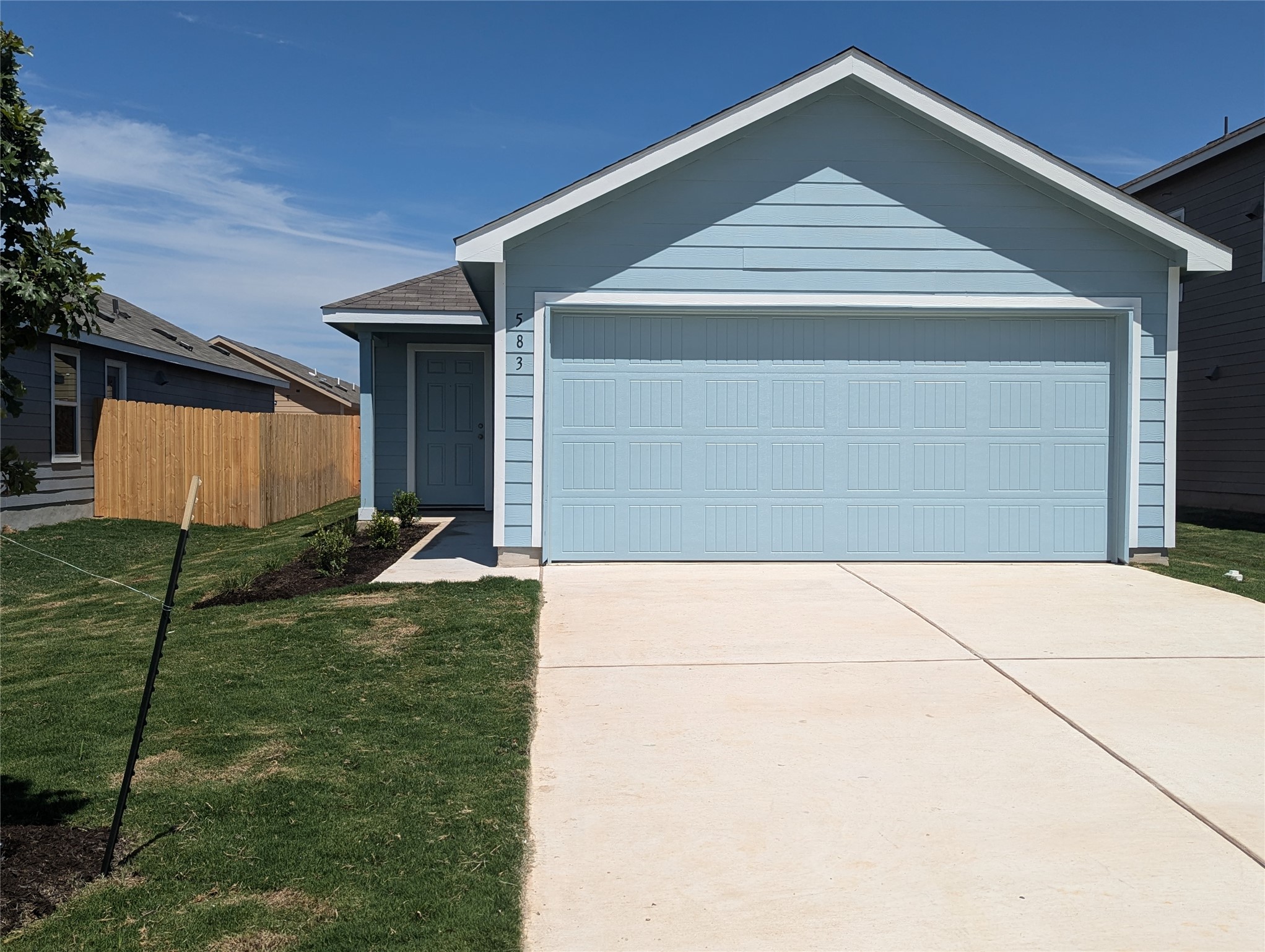 583 Commander Abbott Drive Jarrell, TX 76537 - Photo 2 of 24 a front view of a house with a yard