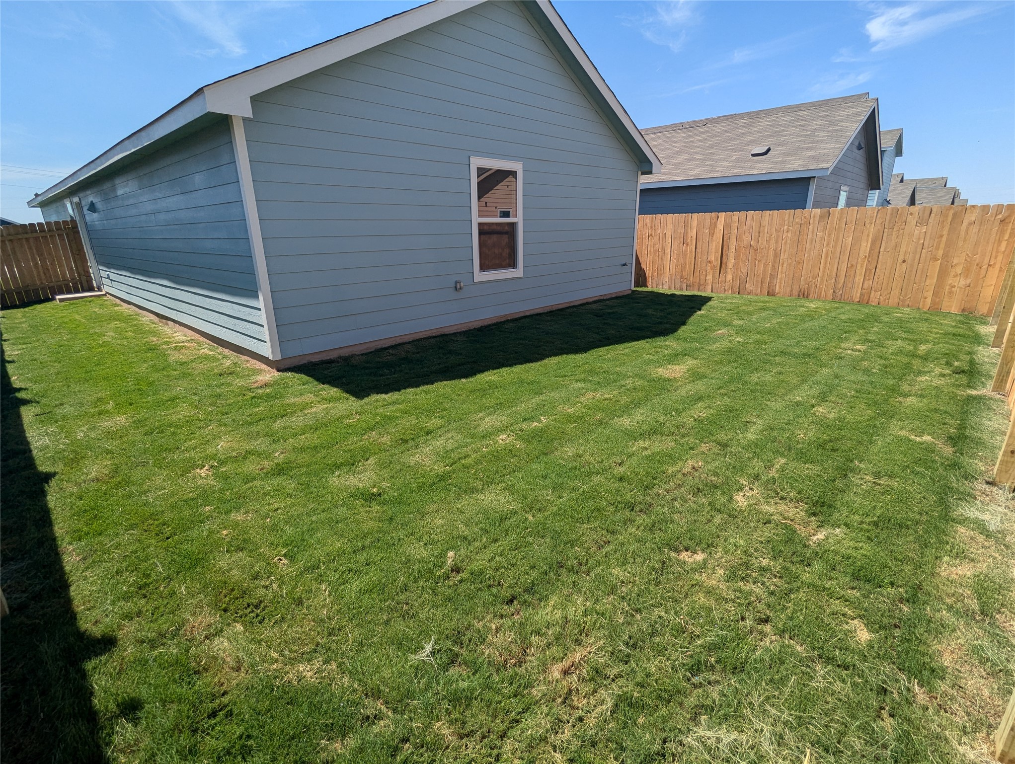 583 Commander Abbott Drive Jarrell, TX 76537 - Photo 20 of 24 a view of a backyard