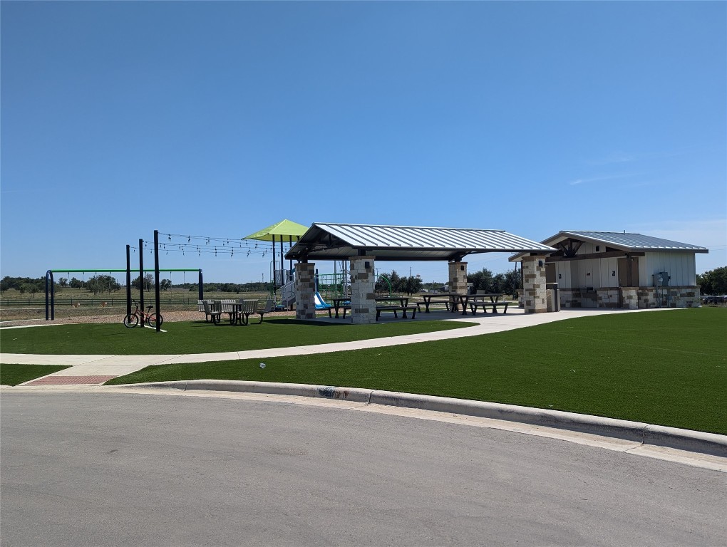 583 Commander Abbott Drive Jarrell, TX 76537 - Photo 23 of 24 a view of a big room with a big yard and large trees
