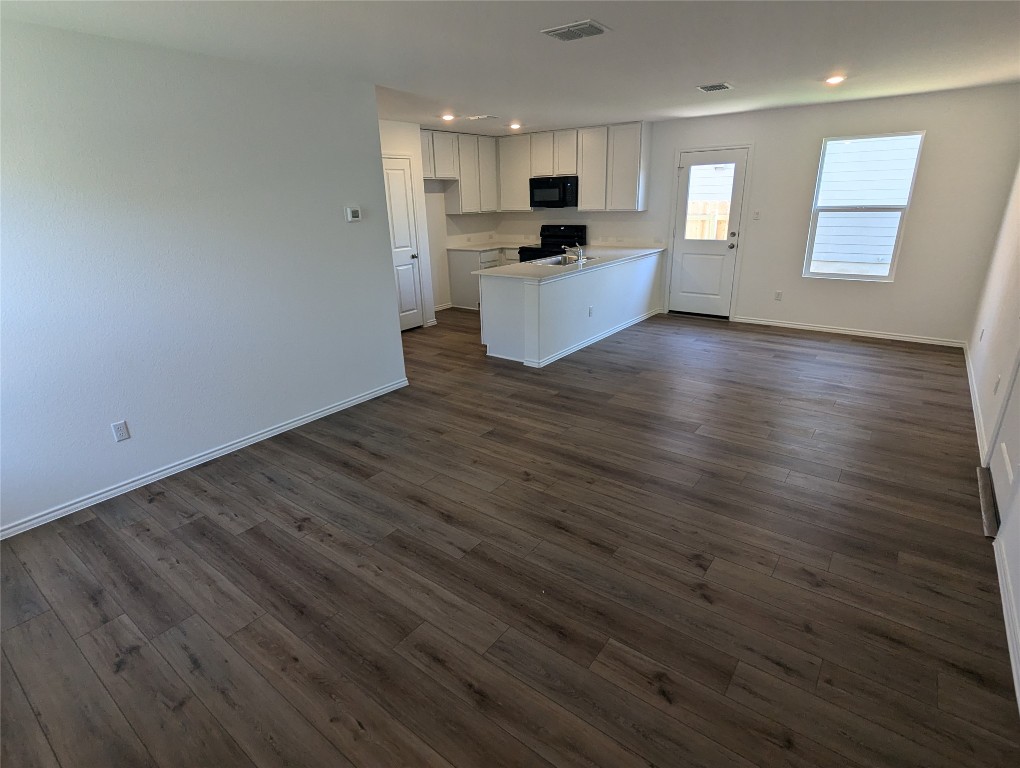 583 Commander Abbott Drive Jarrell, TX 76537 - Photo 24 of 24 a view of kitchen with wooden floor and electronic appliances