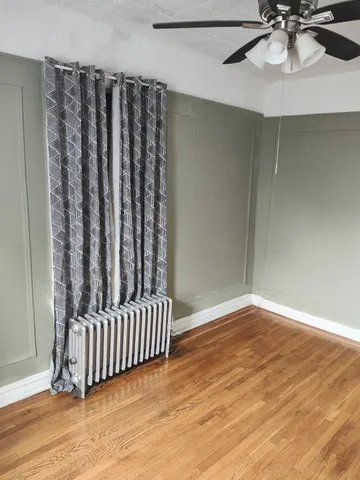 a view of a room with wooden floor and staircase