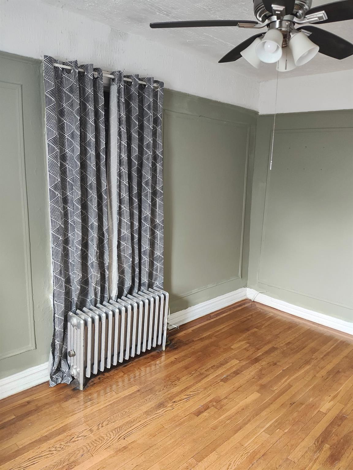 1015 Summit Avenue, Unit 6B Bronx, NY 10452 - Photo 19 of 21 a view of a room with wooden floor and staircase