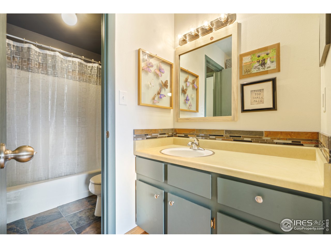 705 East Drake Road, Unit 39 Fort Collins, CO 80525 - Photo 16 of 23 a bathroom with a sink and mirror with toilet