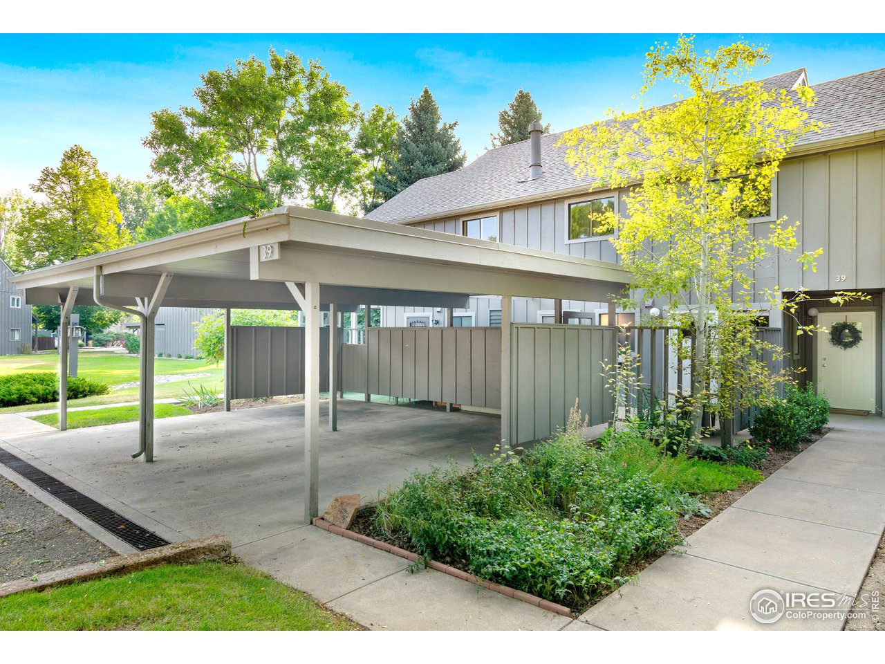 705 East Drake Road, Unit 39 Fort Collins, CO 80525 - Photo 17 of 23 a view of a backyard with a garden and plants