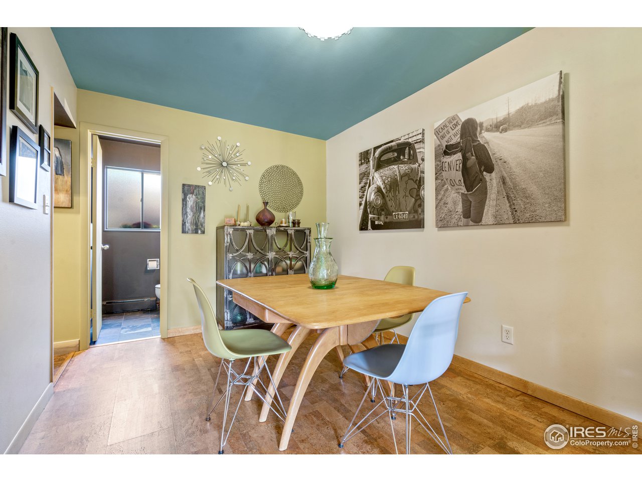 705 East Drake Road, Unit 39 Fort Collins, CO 80525 - Photo 7 of 23 a view of a dining room with furniture and wooden floor