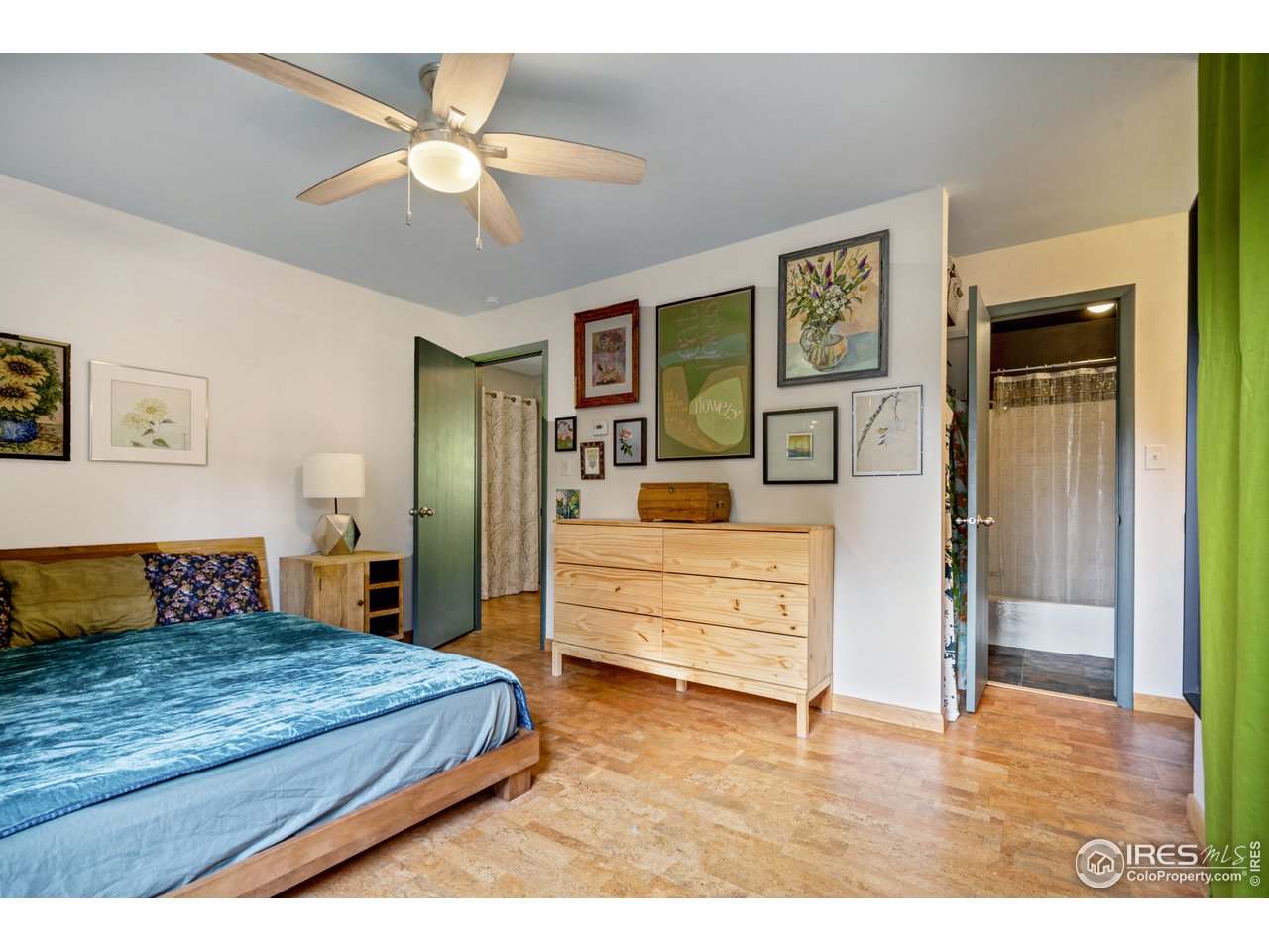 705 East Drake Road, Unit 39 Fort Collins, CO 80525 - Photo 10 of 23 a bedroom with a bed and a chandelier