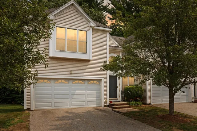 a front view of a house with a garage
