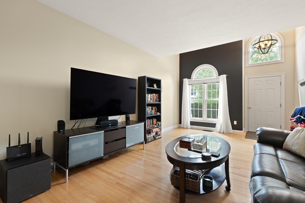 3 Knowlton Circle, Unit 3 Upton, MA 01568 - Photo 12 of 42 a living room with furniture and a flat screen tv