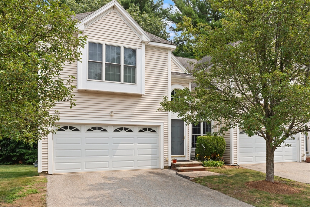 3 Knowlton Circle, Unit 3 Upton, MA 01568 - Photo 2 of 42 a front view of a house with a garage