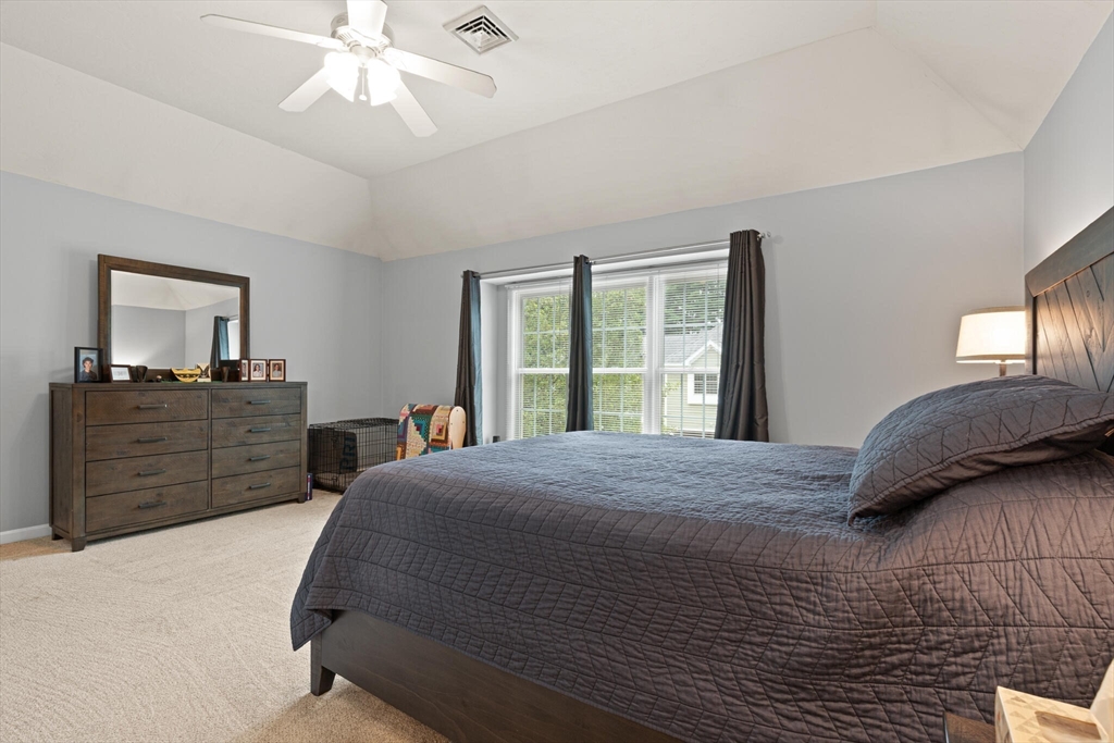 3 Knowlton Circle, Unit 3 Upton, MA 01568 - Photo 26 of 42 a bedroom with a large bed and a window