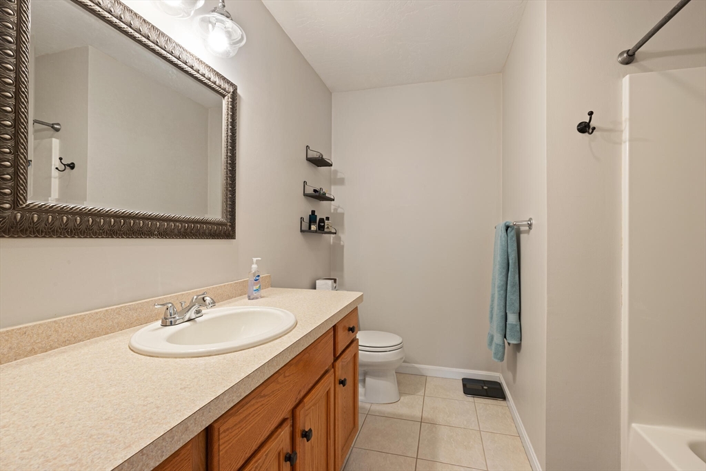 3 Knowlton Circle, Unit 3 Upton, MA 01568 - Photo 30 of 42 a bathroom with a sink toilet and shower