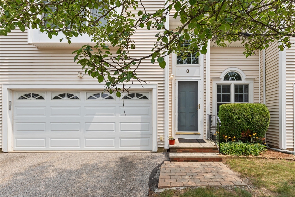 3 Knowlton Circle, Unit 3 Upton, MA 01568 - Photo 3 of 42 a front view of a house with a yard