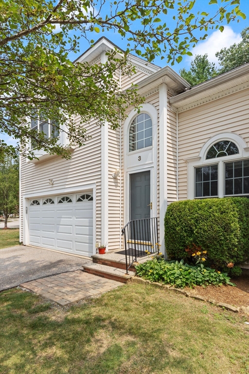 3 Knowlton Circle, Unit 3 Upton, MA 01568 - Photo 4 of 42 a front view of a house with a garden