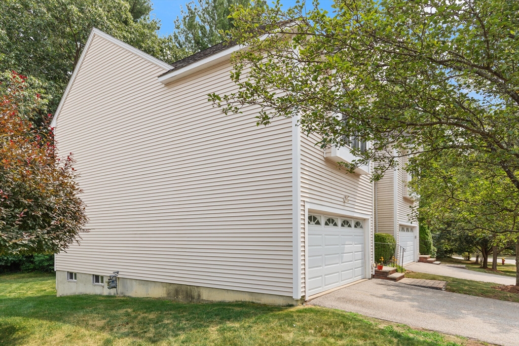 3 Knowlton Circle, Unit 3 Upton, MA 01568 - Photo 5 of 42 a view of a white house with a yard